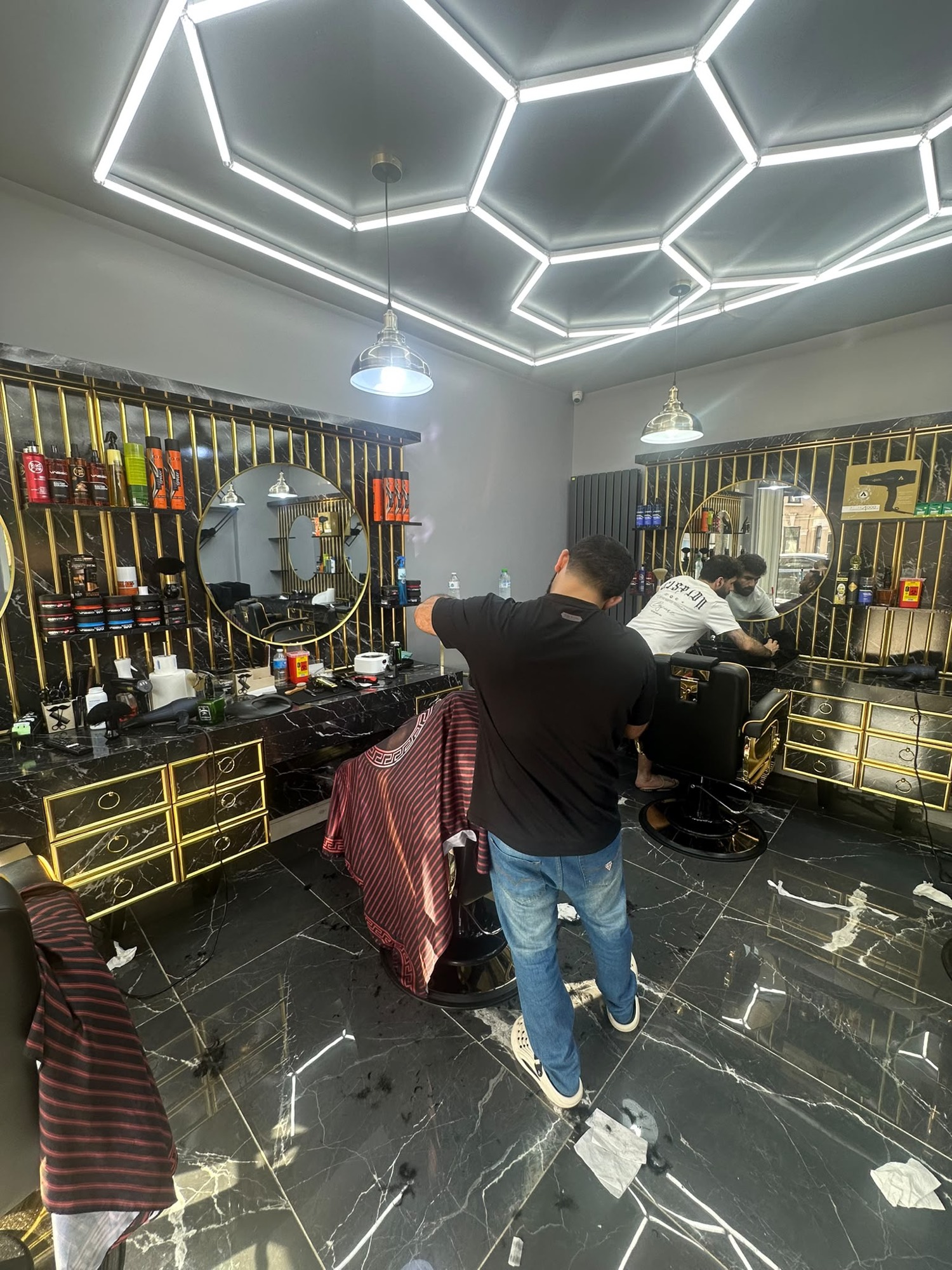 Inside West Ham Barbers — marble and gold studio